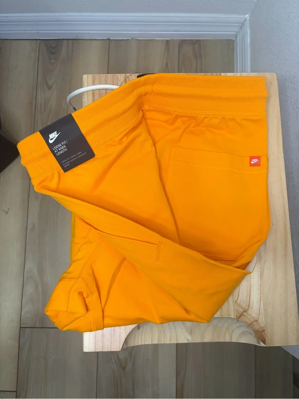 Nike Bright Orange Athletic Shorts with White Swoosh Tag